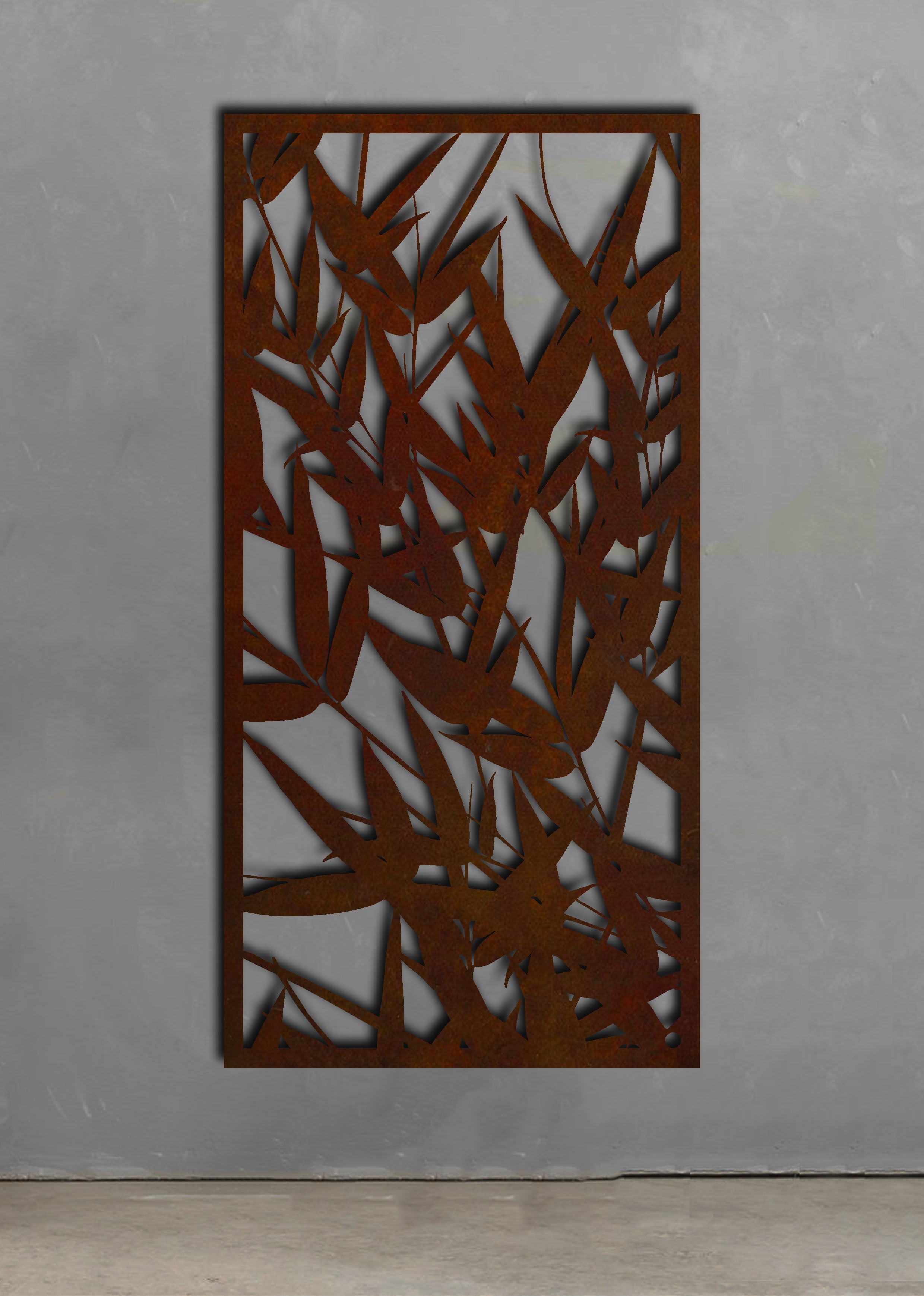 Bamboo leaf outdoor screen showing the rust patina against a concrete wall, resembling outdoor wall art.  Brief Description: This image shows a bamboo leaf outdoor screen with a rust patina, set against a concrete wall. The screen's design resembles outdoor wall art, highlighting the texture and color of the rust finish against the smooth, neutral background of the concrete.